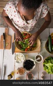 Young African Woman Cooking. Healthy Food - Vegetable Salad. Diet. Dieting Concept. Healthy Lifestyle. Cooking At Home. Prepare Food. Top View