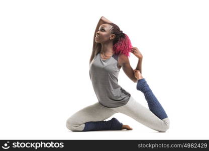 Young african woman doing yoga exercises isolated on white background