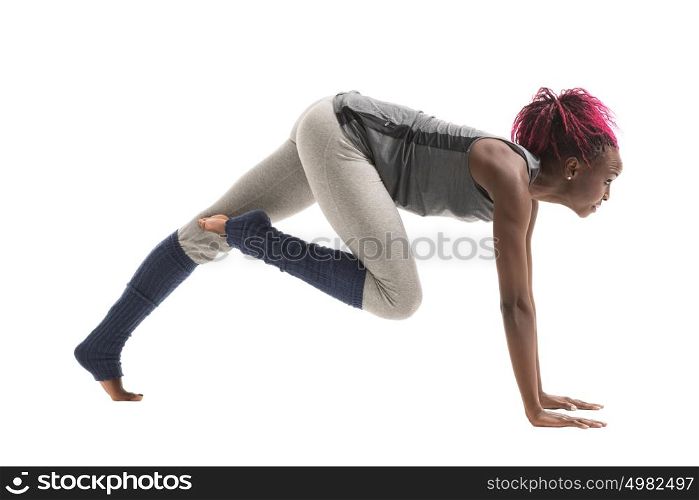 Young african woman doing yoga exercises isolated on white background