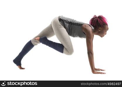 Young african woman doing yoga exercises isolated on white background