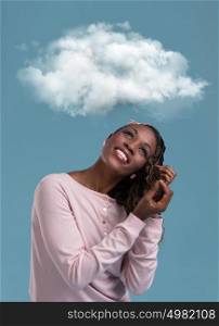 Young african woman dreaming while looking up for thought bubble above her head with copy space