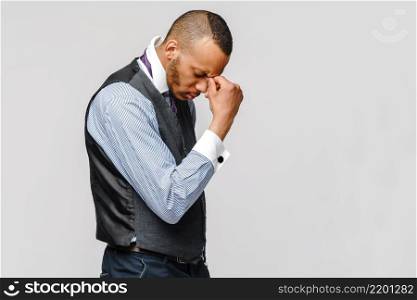 Young afro american businessman touching head because of headache and stress.. Young afro american businessman touching head because of headache and stress