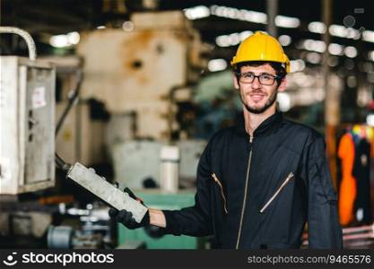 young American happy labor worker enjoy smiling to work in industrial factory for heavy machine operator.