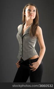 young and beautiful brunette with a waistcoat and black trausers