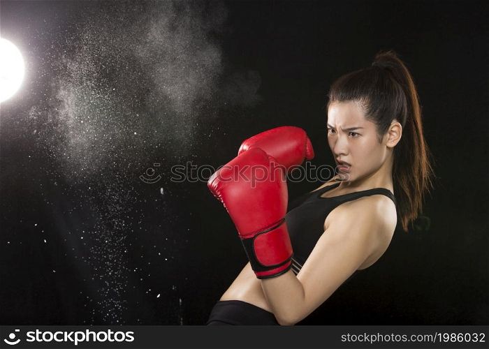 Young and beautiful female boxer