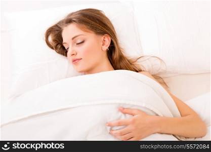 Young and beautiful woman in bed