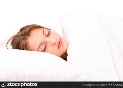 Young and beautiful woman in bed