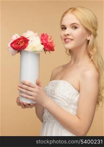 young and beautiful woman with vase of flowers