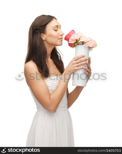 young and beautiful woman with vase of flowers