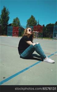 Young and cool woman in a schoolyard