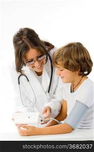 young and cute female doctor taking a blood pressure to a little boy