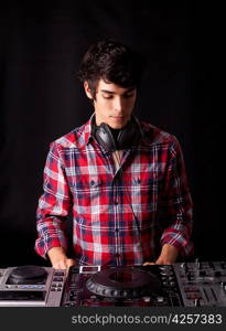 Young and handsome dj playing some music