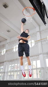 young and healthy people man have recreation and training exercise while play basketball game at sport gym indoor hall