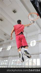 young and healthy people man have recreation and training exercise while play basketball game at sport gym indoor hall