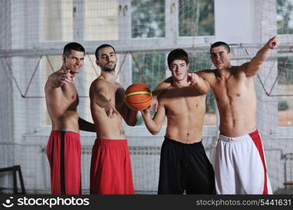 young and healthy people man have recreation and training exercise while play basketball game at sport gym indoor hall