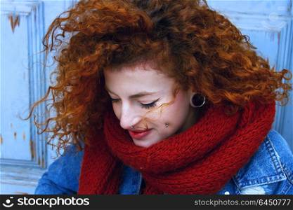 Young and pretty redhead woman wearing winter clothes