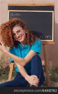 Young and redhead kindergarten teacher