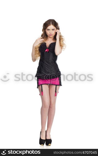 Young and sexy blond woman in black corset lingerie bright makeup isolated on white