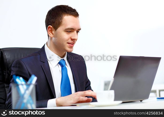 Young and successful businessman in the office