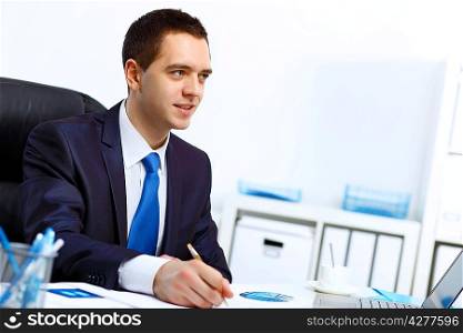 Young and successful businessman in the office