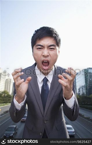 Young Angry Businessman Yelling