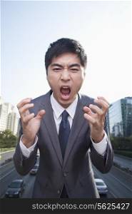 Young Angry Businessman Yelling