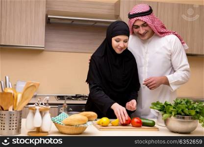 Young arab family in the kitchen