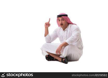 Young arab man sitting isolated on white