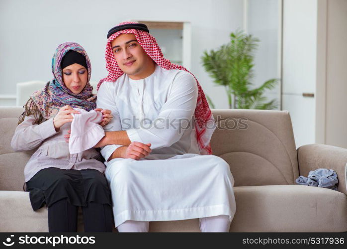 Young arab muslim family with pregnant wife expecting baby