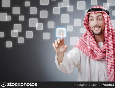 Young arab pressing virtual buttons