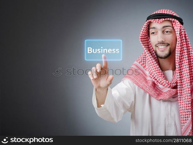 Young arab pressing virtual buttons