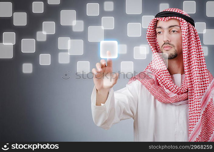 Young arab pressing virtual buttons