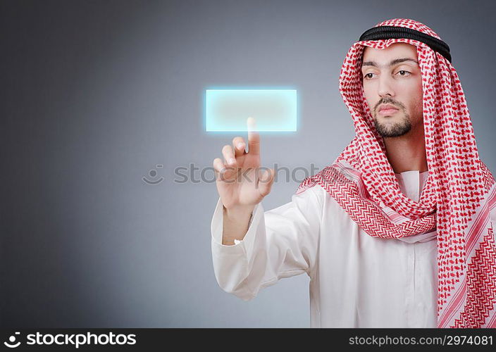 Young arab pressing virtual buttons