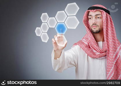 Young arab pressing virtual buttons