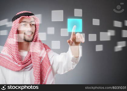 Young arab pressing virtual buttons