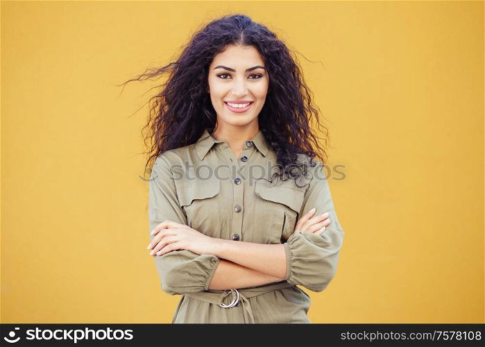 Young Arab Woman with curly hair in urban background. Young Arab Woman with curly hair outdoors