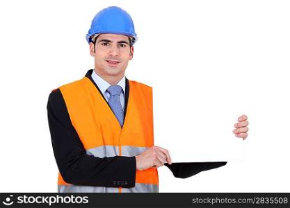 young architect holding board against white background