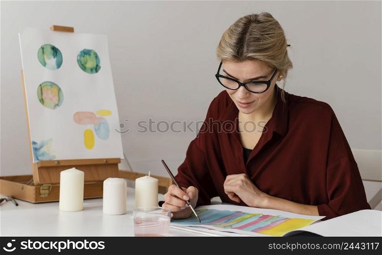 young artist painting with watercolors 3