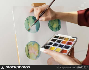 young artist painting with watercolors. High resolution photo. young artist painting with watercolors. High quality photo