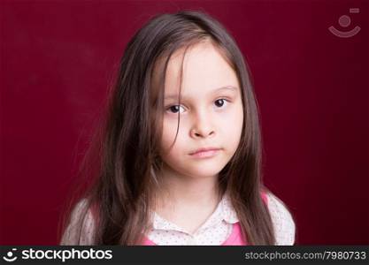 Young Asian American girl looking unhappy