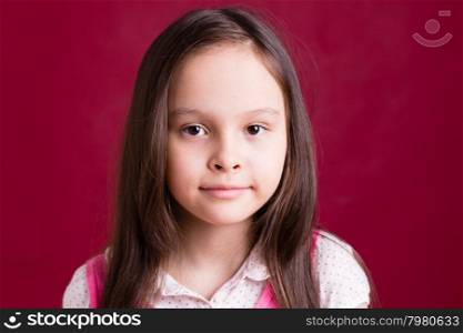 Young Asian American girl on red background
