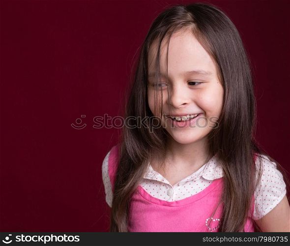 Young Asian American girl smiling and looking away