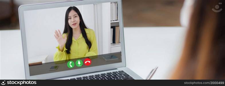 Young asian business woman video conference call online for discussion about statistics of finance with laptop computer, businesswoman explaining report, social distancing.
