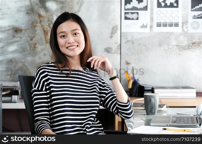 Young asian businesswoman working with happy emotion, working at home, office casual lifestyle concept