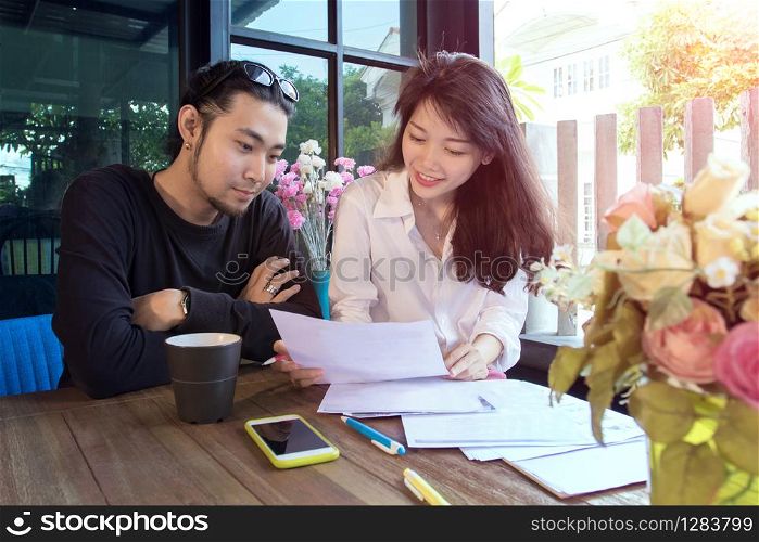 young asian freelance working at home happiness and smiling face