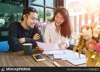 young asian freelance working at home happiness and smiling face