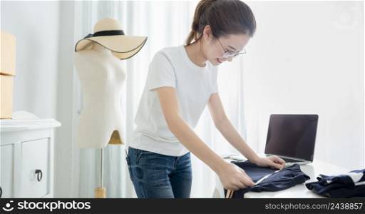 Young asian girl is freelancer with her private business at home office. Fashion designer stylish showroom concept