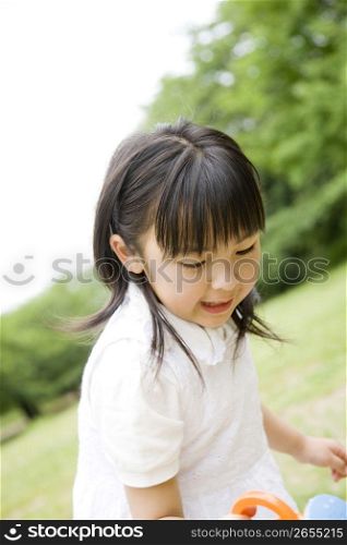 Young asian girl playing