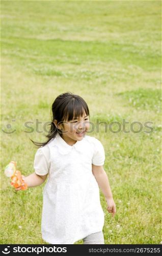 Young asian girl playing