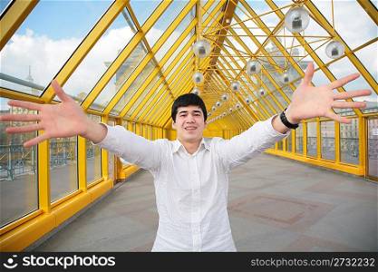 young asian man shows salutatory gesture